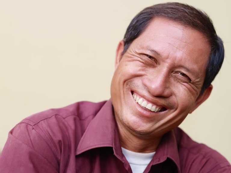 When a tooth or teeth are missing, it can affect the person’s confidence and ability to talk or eat. Having [dm-name] in [dm-citystate] provide a solution to the missing teeth can help a person have more normal functioning of the mouth and an improved state of health and well-being. Schedule an appointment at [dm-name] to find out the best solution to your missing teeth. Generally, dentists would recommend having either dentures or implants put in to fill the gaps of the missing teeth and restore function to the mouth. Which choice is right for your situation? OPTION 1: DENTURES Dentures, which are appliances in the shape of teeth that you put in and take out, are one of the solutions dentists provide for missing teeth. Dentures are able to replace a few teeth or all of them, and they give the added benefit of filling in the face where the facial muscles have drooped. Dentures can provide a nice look that’s similar to natural teeth while also offering improved function for eating and talking. If some natural teeth can remain in the mouth, [dm-name] could use partial dentures. When all of the teeth are missing or the dentist removes the last ones, a full removable denture could be used. Dentures have some downsides, which include a lack of permanency, feeling uncomfortable and the potential for the teeth moving from their position. On the upside, they improve the look and function of the mouth, can provide new teeth for the entire mouth and offer a solution when the jawbone or gums cannot support the permanent option of implants. OPTION 2: IMPLANTS Unlike dentures, which are removable, implants are permanently placed in the mouth. This solution involves posts that go into the jawbone and are finished with replacement teeth. Implants look natural and are able to match the natural surrounding teeth. Plus, they provide a strong replacement to natural teeth to offer full mouth functioning for eating and talking. Many people prefer implants to dentures when the mouth is able to support them because they create permanent teeth. They are not right for people with weakened jaws or gums, or generally when all teeth are missing. Another downside is that getting implants requires extensive dental work that happens in stages. Because of the bone healing required in this procedure, it is generally reserved for healthy people without certain health conditions. This option tends to be best for healthy people who are missing a few teeth, have a strong jawbone to hold the implants and want to have permanent teeth rather than removable ones. In the end, the final decision of getting dentures or implants should happen in a discussion with your dentist. When you schedule an appointment, [dm-name] will provide a consultation of your situation and help you understand the pros and cons of implants compared to dentures for your situation. Contact our Philadelphia dental office today at [dm-phone] so we can help you make this important decision to fit your needs and provide the best outcome.